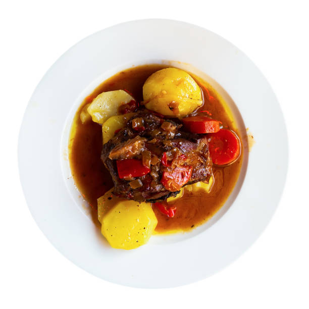 istock Appetizing lamb shoulder baked with potatoes and stewed vegetables 1256467396