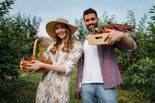 istock Beautiful couple in the orchard 1256468077