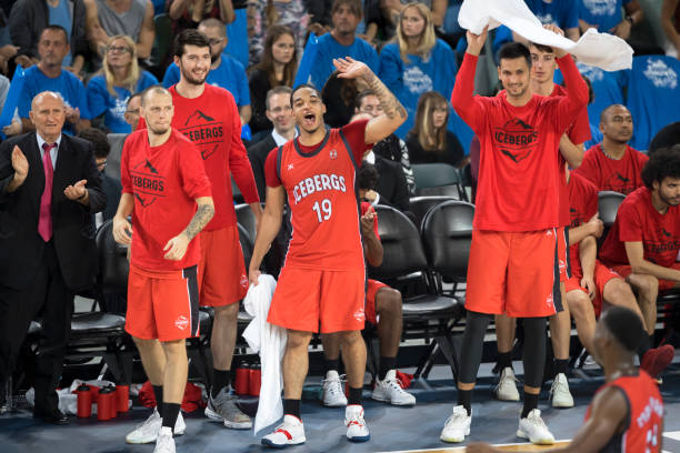 istock Basketball players celebrating 1256468078