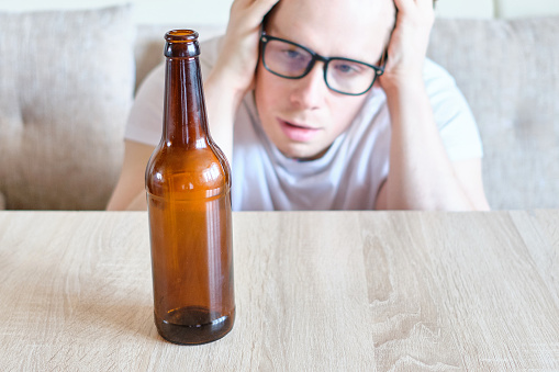 A man got drunk after drinking beer from a bottle