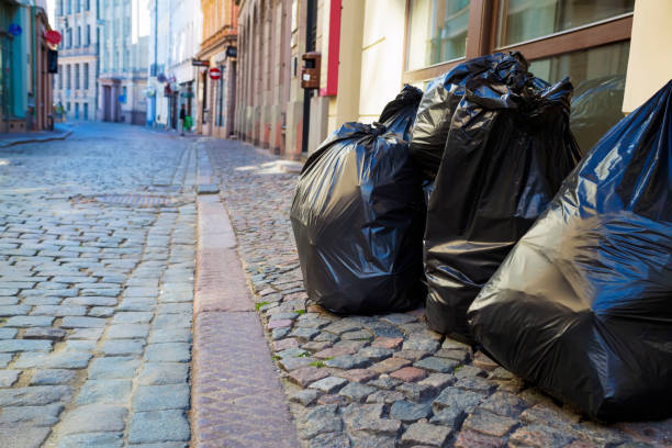 istock Garbage bags on an empty street 1256472208