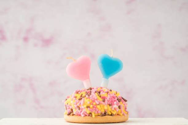 istock cupcake with heart shaped candles for birthday 1256472244