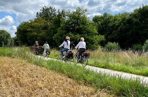 Schinnen, the Netherlands, - July 12, 2020. People making bicycle trip in the country on a sunny Sunday mid of July.