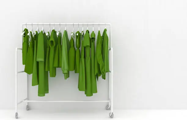 Hanger with green women's clothing against the background of a white wall. Monotonous green clothes. Creative conceptual illustration with copy space. 3D rendering