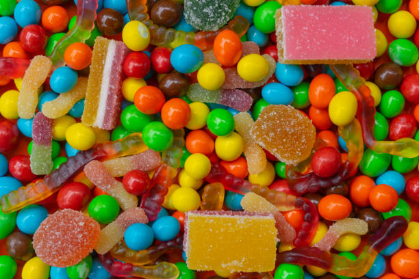 istock Colorful background from multi-colored sweets and marmalade. 1256474806