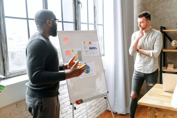 istock Discussion in contemporary multiracial office 1256477078