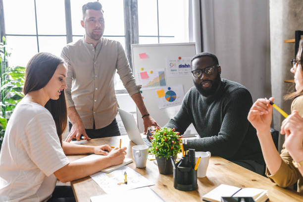 istock Multiracial team in contemporary office 1256477150