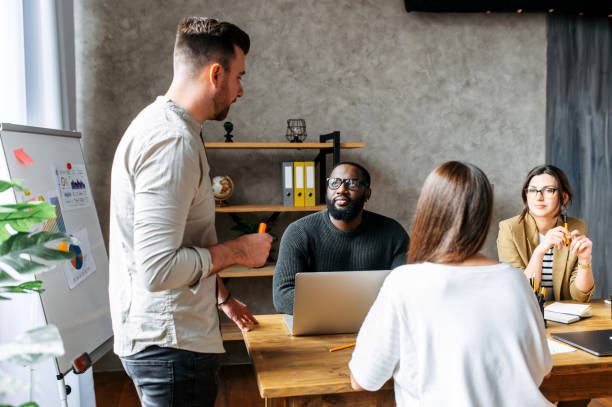 istock Multiracial team in contemporary office 1256477154