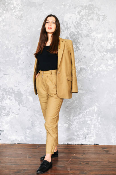 istock Beautiful brunette woman in suit. Studio shot 1256477173