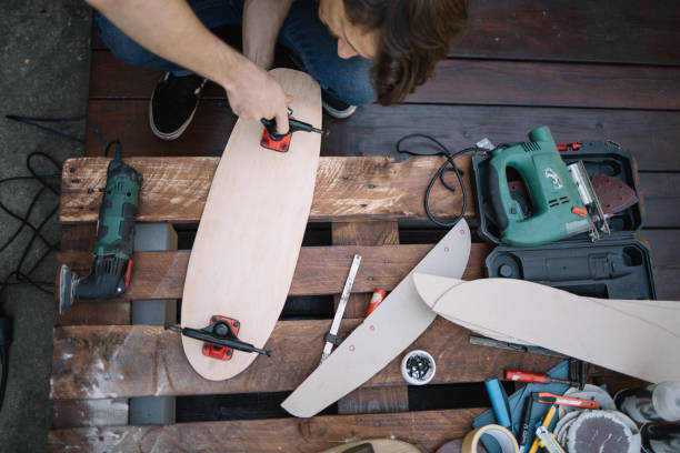 istock Top view of brunette man assembling skateboard parts 1256477830