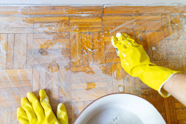 istock Cleaning a parquet floor with foam on the floor 1256477848