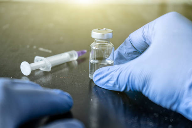 istock The doctor holds the ampoule 1256477898