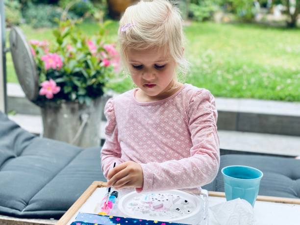 istock Homeworking school girl 1256478353