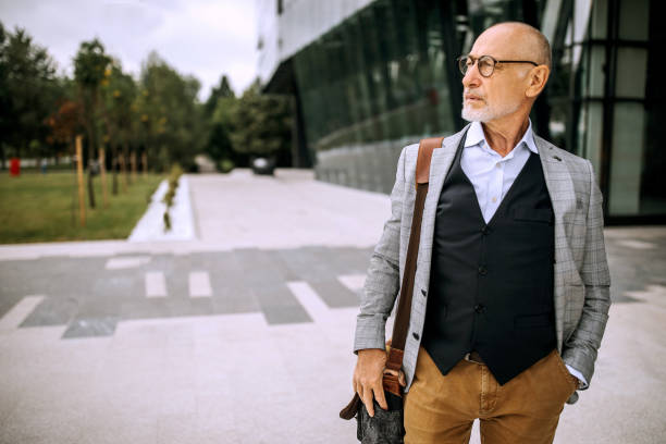istock Senior businessman leaving after working 1256479367