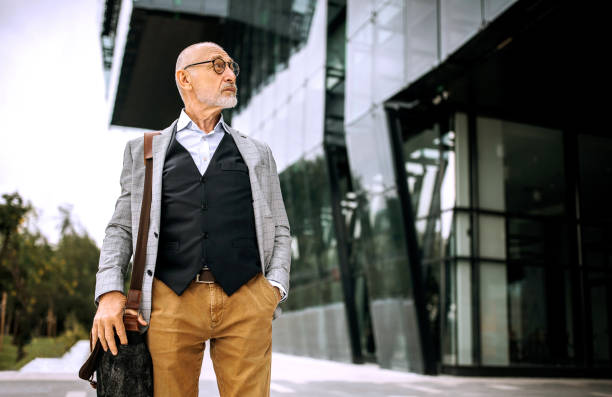 istock Senior businessman leaving after working 1256479382
