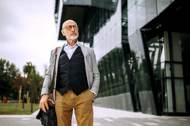 istock Senior businessman leaving after working 1256479419