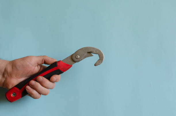 istock Universal wrench in a male hand. 1256480874