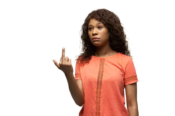 Photo of Young african-american woman with funny, unusual popular emotions and gestures isolated on white studio background