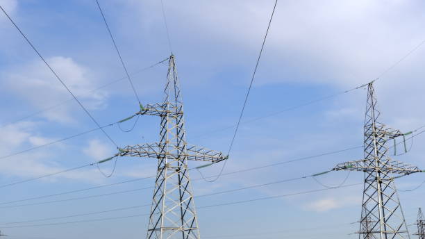 istock Electric pole with wires in the countryside 1256484590