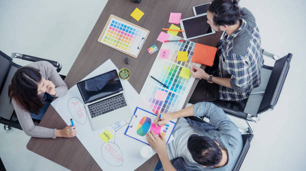 istock Diversity Creative Design Collaboration Team Meeting Communication with Business Partners Teamwork Working Together in Conference Room. Group of young people Meeting Trust in Businessman and Team. 1256485386