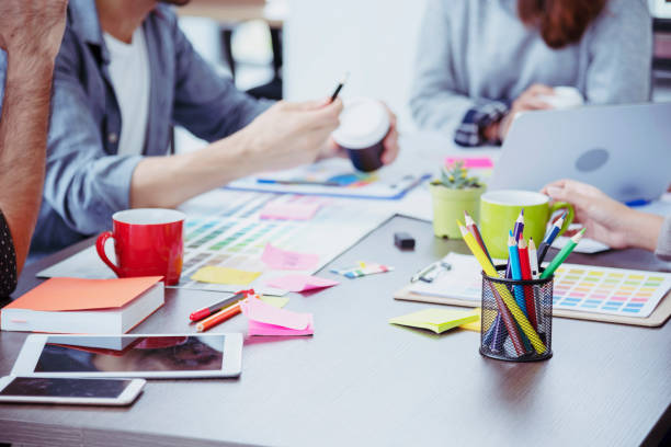 istock Diversity Creative Design Collaboration Team Meeting Communication with Business Partners Teamwork Working Together in Conference Room. Group of young people Meeting Trust in Businessman and Team. 1256485978