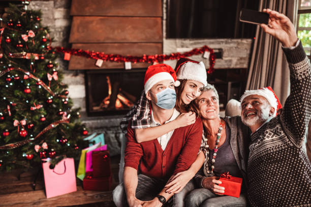 istock taking a selfie at home for christmas during the covid 1256486037