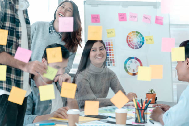istock Diversity Creative Design Collaboration Team Meeting Communication with Business Partners Teamwork Working Together in Conference Room. Group of young people Meeting Trust in Businessman and Team. 1256486123