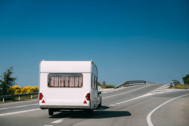 istock White Colour Motorhome Car Goes On Motorway Road 1256486392