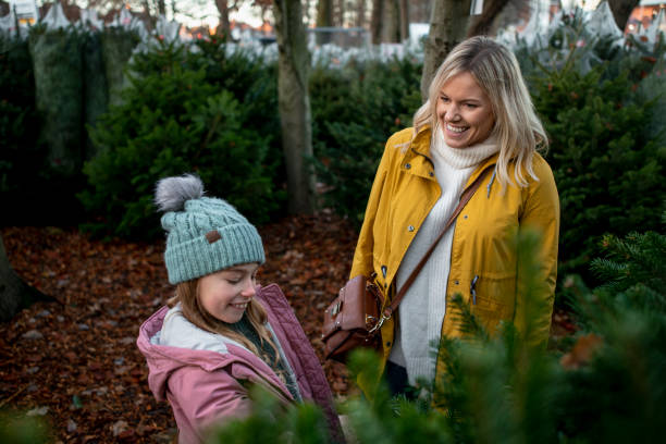 istock Helping Mum Choose a Christmas Tree 1256486461