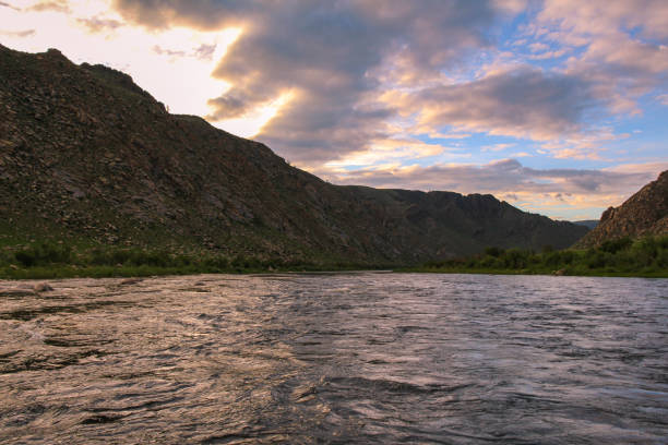 istock Sunset and twlght over a fast flowing river in Mongolia 1256489270