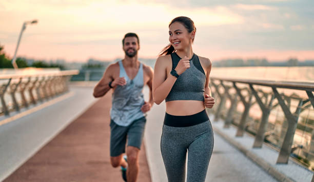 istock Couple doing sport on the street 1256489310