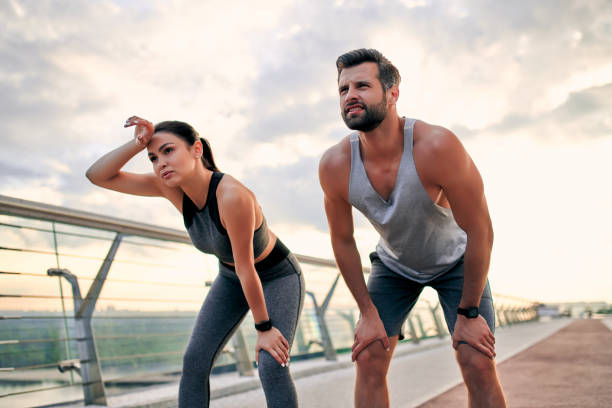 istock Couple doing sport on the street 1256489332