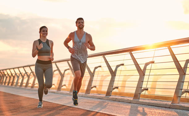 istock Couple doing sport on the street 1256489355