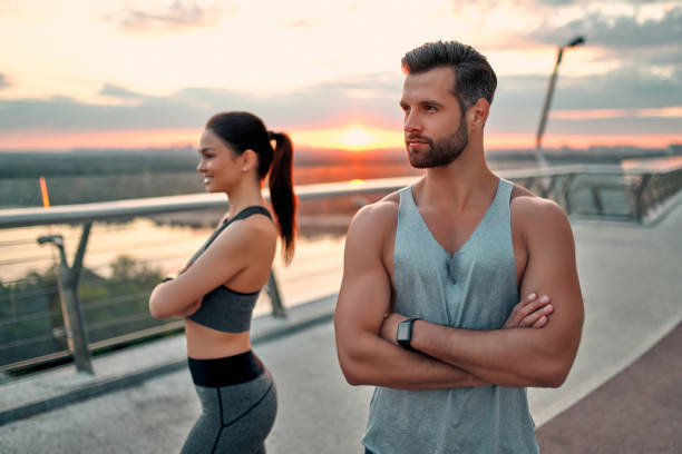 istock Couple doing sport on the street 1256489549