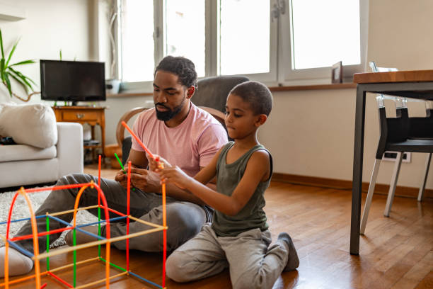istock Father and son having fun with creative toys 1256489807