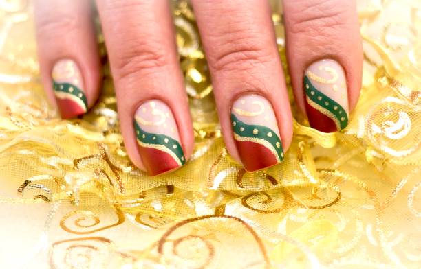 Green Gold and Red Christmas Nail Art Design Holiday Inspired Art christmas nails stock pictures, royalty-free photos & images