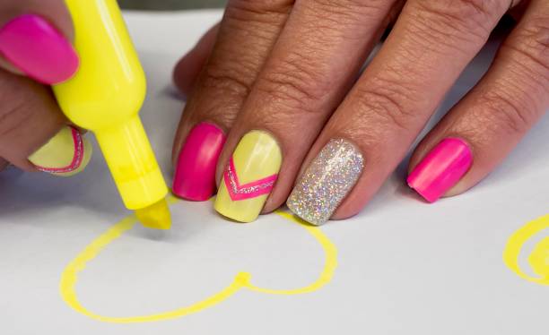 Neon Pink and Yellow Nail Art Design Summer inspired Art yellow nail polish stock pictures, royalty-free photos & images