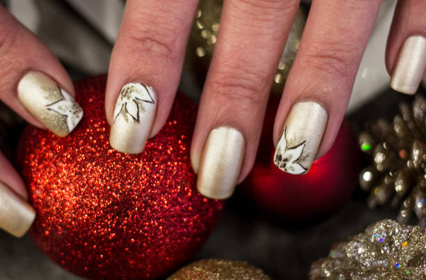 White Poinsettia Nail Art Design Christmas Inspired Art christmas nails stock pictures, royalty-free photos & images