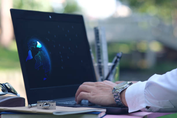 istock Businessman working laptop computer on wooden table and technology concept 1256493955