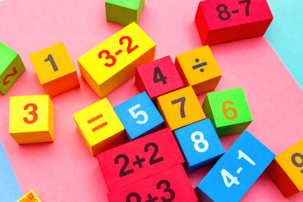 child kid colorful education toys cubes with numbers math pattern background on the bright background. Flat lay. Childhood infancy children babies concept.