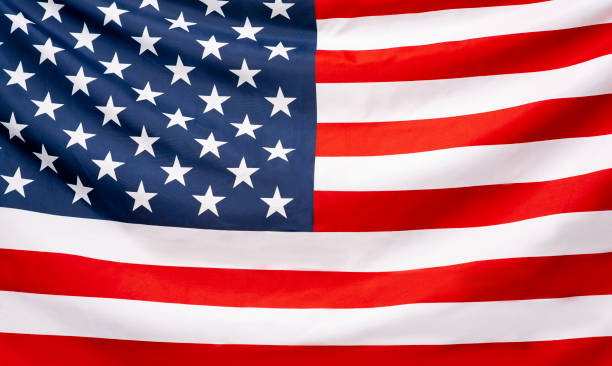 istock Beautifully waving star and striped American flag, web banner 1256499096