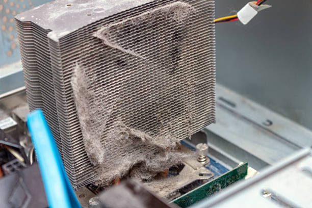 istock Dusty old cooler radiator on a computer service. Maintenance repair. 1256499597