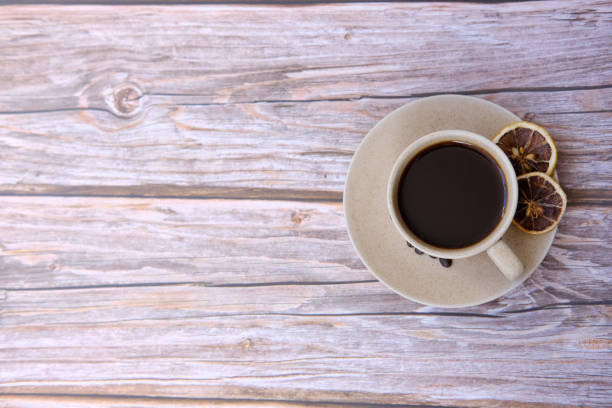 istock Top view coffee cup on wooden background and space for text 1256499654