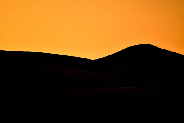 istock sunset in mountains, photo as background 1256502082