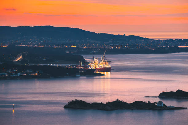 Alesund, Norway. Night View Of Moored Ship In Alesund Island. Summer Morning Alesund, Norway. Night View Of Moored Ship In Alesund Island. Summer Morning more og romsdal county stock pictures, royalty-free photos & images