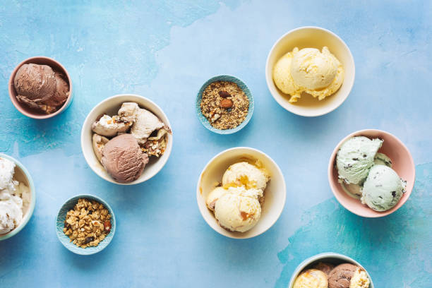 istock Various ice cream desserts in bowls on rustic blue background 1256504091