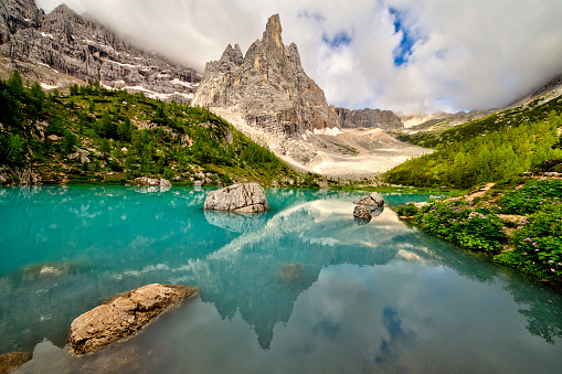 Turquoise Sorapis Lake near Cortina d'Ampezzo, with Dolomite Mountains and Forest - Sorapis Circuit, Dolomites, Italy, Europe, summer picture.