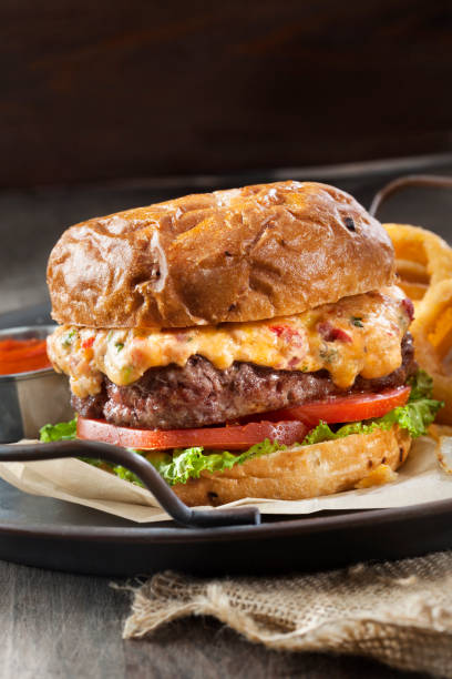 istock Pimento Cheese Burger with Lettuce, Tomato and Thick Cut Onion Rings 1256504219