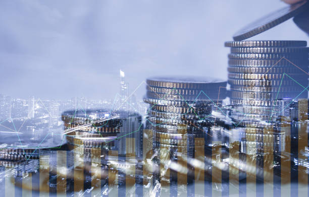 istock double exposure of city with row of coin stack with growth chart and graph progress report for business investment finance banking and money saving concept. 1256505485
