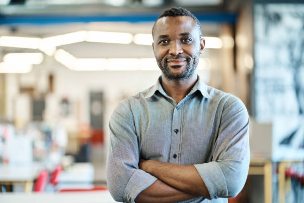 istock Confident young African American designer standing in a modern office 1256509750